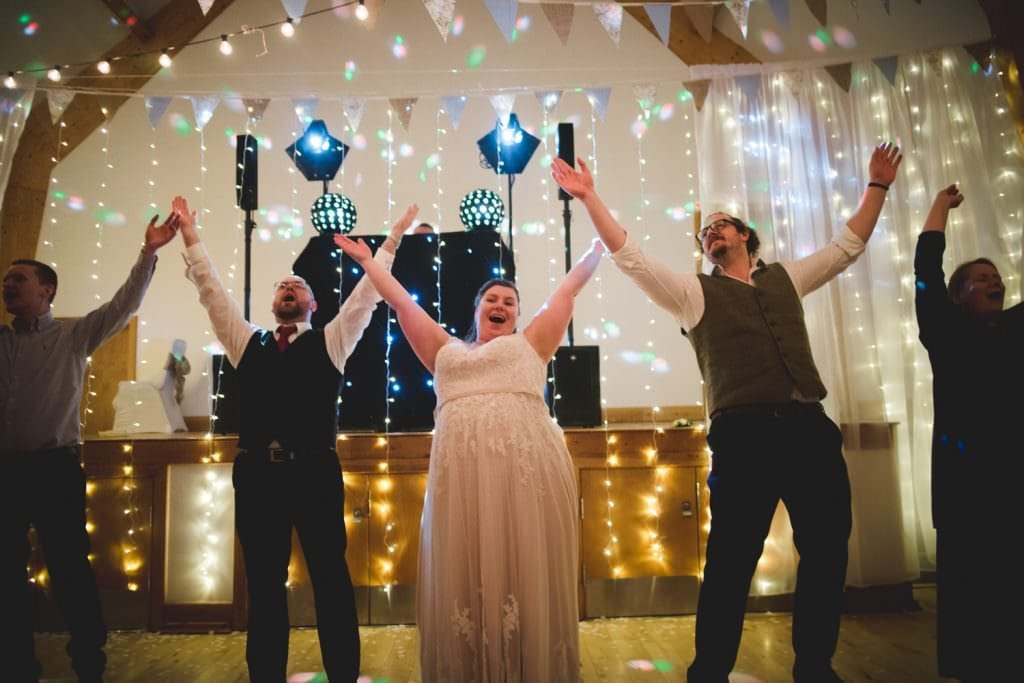 guests dancing at wedding reception at Rock Village hall
