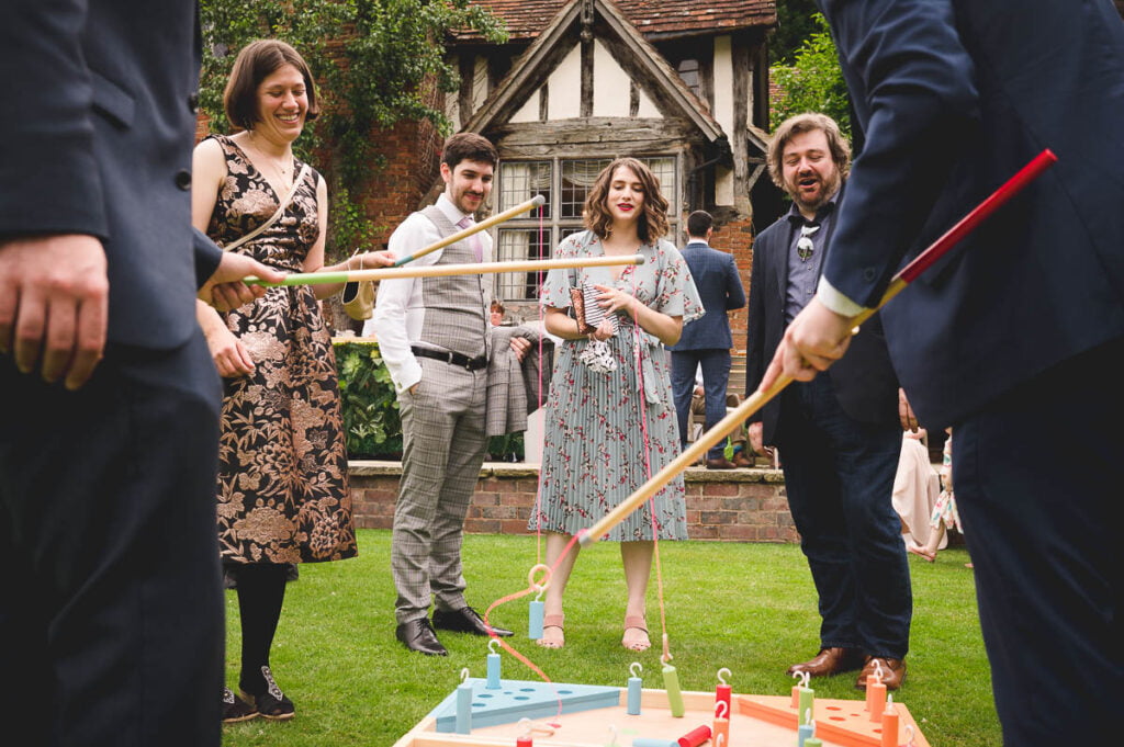 Guests playing garden games at Gorcott Hall wedding