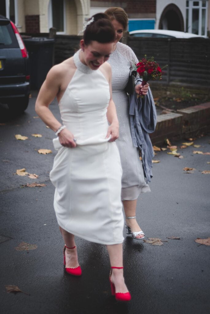 Bond Digbeth Birmingham Wedding Photography of bride in her elegant wedding dress and red shoes.